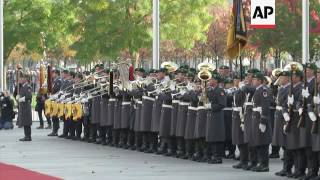 Merkel welcomes Buhari with military honours