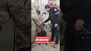 Polis və hərbiçilərimiz yaşlı erməni qadına yardım edir