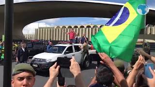 Brazilian President joins supporters in a motorcade protest against quarantine and social distancing