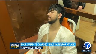 4 men charged in Moscow attack, showing signs of beatings at hearing as court says 2 accept guilt