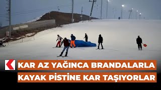 Kar az yağınca brandalarla kayak pistine kar taşıyorlar