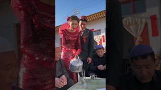 Chinese Muslim bride pours tea to her elders