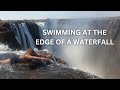 {4k} ANGELS POOL Victoria Falls, Zambia: Swimming at the Edge of the Cliff in Livingstone Island