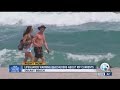 Lifeguards warning beachgoers about rip currents