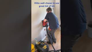 Hilti wall chaser in action, vacuum is in use to minimise dust