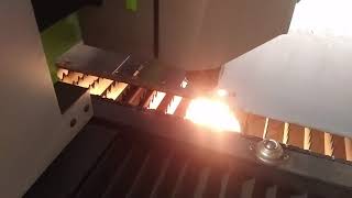 1kW CNC fiber laser crashing into a high spot on the sheet metal