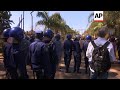 Scuffles as MDC supporters march through Harare, gather outside electoral commission