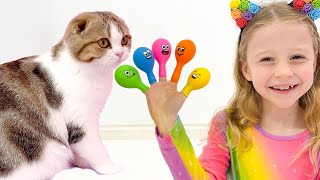 Nastya pretends to play and teaches kittens colors