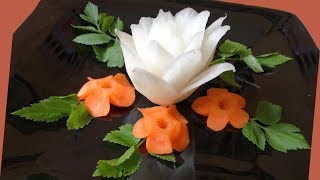 Art Of Carving White radish garnish With Carrot Flower