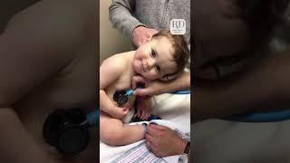 Adorable Baby Boy Cuddles on Nurse