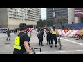 vehicle drives through portage and main protest