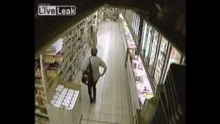 woman caught on CCTV pinching a loaf in supermarket