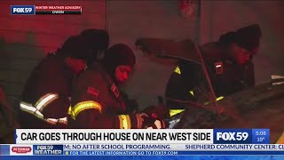 Car crashes through house on near west side