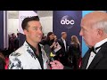 Lucas Hoge speaks to Jimmy Carter on the CMA Awards Red Carpet