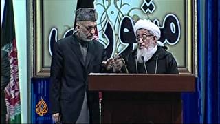 Afghan elders and Karzai differ over pact timing