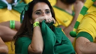 An emotional Brazil fan & Team reacts after being defeated by Germany 7-1 Photo Preview