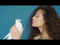 Young curly Girl with white dove | 4K | nocopyright stock clips | NSC