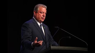 Former U.S. VP Al Gore speaks to reporters about the election, climate change, and race
