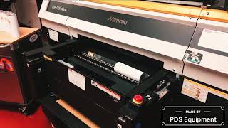 Printing direct to bottles on the Mimaki UJF -7151 UV printer with PDS Equipment.