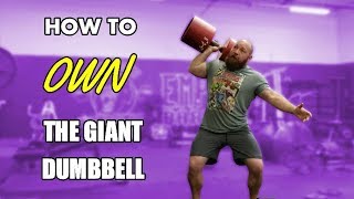 How to Clean and Press a Giant Dumbbell - Technique for One Arm Circus Dumbbell Press