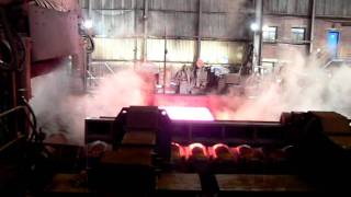 Steel Mill: Rolling and Descaling of Hot Steel Slabs