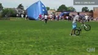 13 injured when INFLATABLE-BOUNCE HOUSE blows away