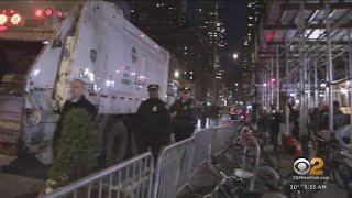 NYPD removes asylum seekers from outside Watson hotel