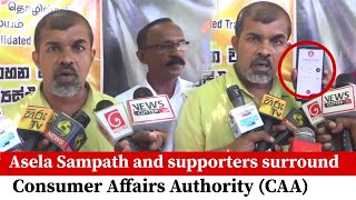 Asela Sampath and supporters surround Consumer Affairs Authority (CAA)