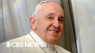 Pope Francis remains hospitalized, shows signs of improvement