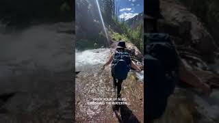 Girl Loses Footing and Falls While Crossing Waterfall on Trail - 1503299