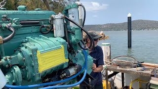 Craning the Detroit Diesel into the trawler