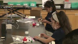 Kaiti’s Science Lab makes cotton ball catapults at Brooks Collegiate Academy