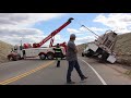 tow truck crew recover rolled cement truck