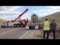 tow truck crew recover rolled cement truck