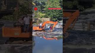 Watch: People Using Crane To Make Their Way Through Flooded Roads