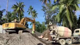 Mixer Truck assisted with the excavator