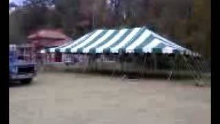 30ft x 70ft Green/white Canvas Tent for Sale. Poles ropes and stakes included!