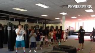 Dalton Outlaw from Element boxing gym teaches kids how to jab