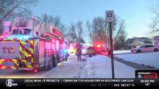 Crews battle house fire in southeast Lincoln