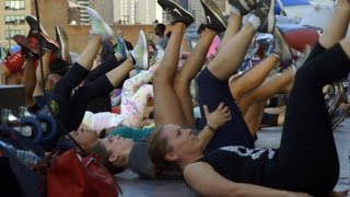 Hundreds do burpees on the USS Intrepid