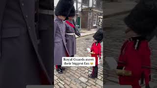 Adorable moment Royal guards meet their biggest fan in minature uniform in London