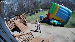 Video shows bounce house picked up in wind, flys toward Hickory child