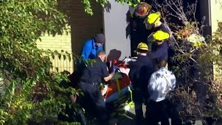 Crews rescue workers trapped in manhole