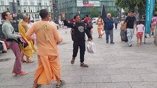 Patita Pavana Prabhu Chants Hare Krishna at Stalingrad in Paris and a Guy Dances