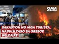 Greece wildfires force thousands of tourists to evacuate | GMA News Feed