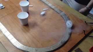 Liquid nitrogen cooled superconductor levitating on a magnetic track