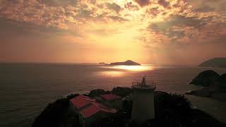 Stock Footage - lighthouse, sky, sunrise, sunset, ocean, mountains, beautiful, 4k