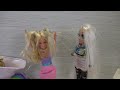 Elsa and Anna toddlers help at the rainbow hair salon