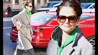 Back to her street style: Katie Holmes steps out in a bathrobe-inspired coat over a HOODIE... after