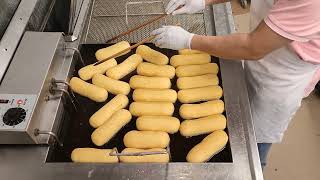 Frying Long John donuts